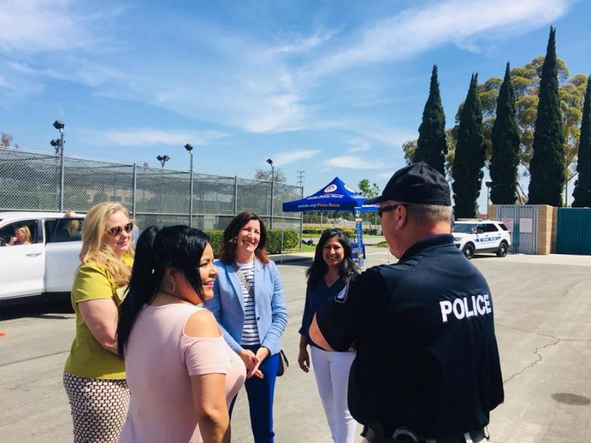 Asm. Petrie-Norris speaking with Irvine Police with Irvine Councilwomen Melissa Fox and Farrah Khan and Senior Field Representative Claudia Perez.